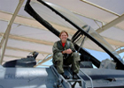 Major Gina Sabric Poses with Her Plane